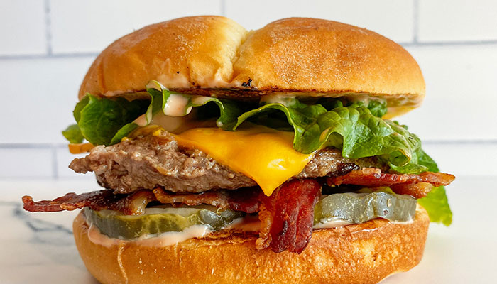 Cheeseburger with bacon, lettuce, pickles from Fanci Freeze in Boise and Meridian Idaho.