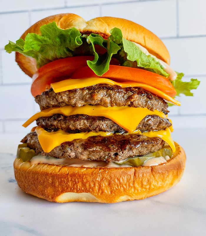 Triple cheeseburger with lettuce, tomato from Fanci Freeze in Boise and Meridian Idaho.